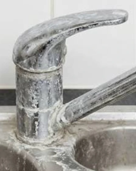tap with build up from limescale tap with build up from limescale in the bathroom area